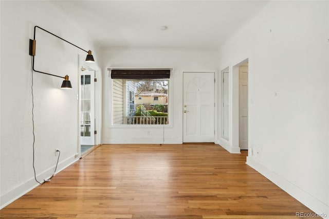 interior space featuring light wood-style floors and baseboards