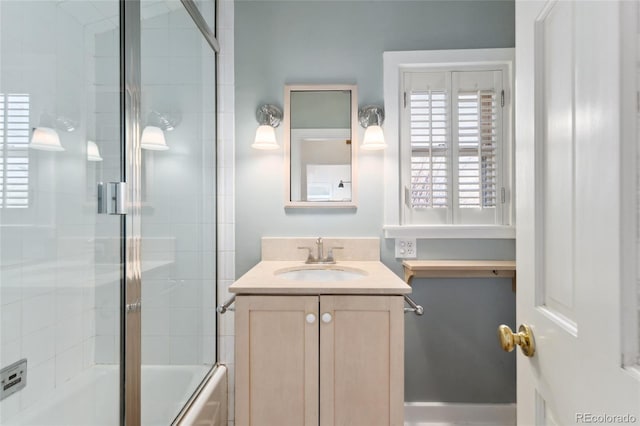 full bathroom with vanity and enclosed tub / shower combo