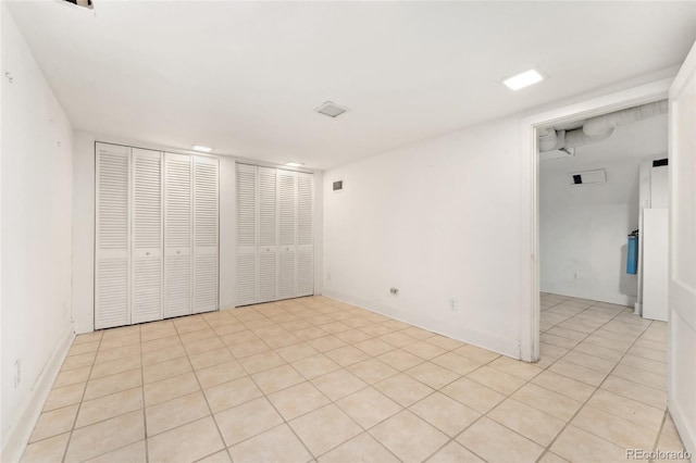 interior space featuring baseboards and a closet