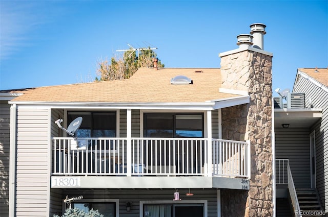 rear view of house with a balcony