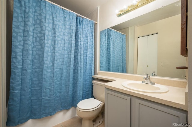 bathroom featuring tile patterned flooring, vanity, toilet, and a shower with curtain