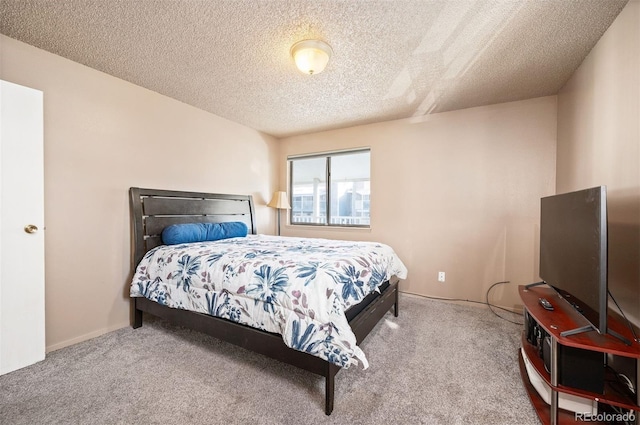 carpeted bedroom with a textured ceiling