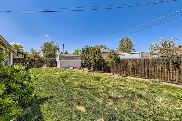 view of yard featuring a shed and an outbuilding