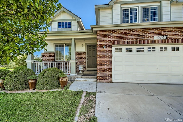 view of front facade featuring a garage and covered porch