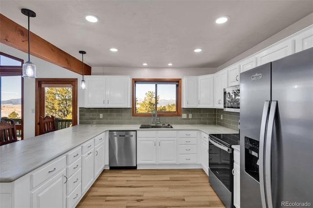 820 Schulze Ranch Rd, Westcliffe, CO 81252 - kitchen featuring appliances with stainless steel finishes, a sink, a peninsula, healthy amount of natural light, and recessed lighting