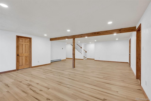 820 Schulze Ranch Rd, Westcliffe, CO 81252 - finished basement featuring a baseboard heating unit, recessed lighting, stairs, light wood-style flooring, and baseboards