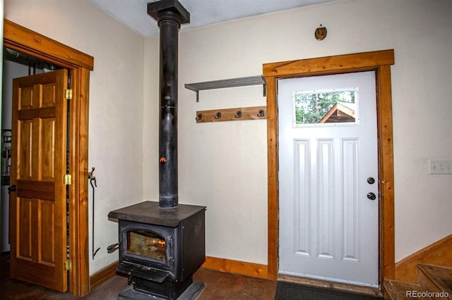 10 Bullion Mine Rd, Keystone, CO 80435 - foyer entrance featuring a wood stove and baseboards