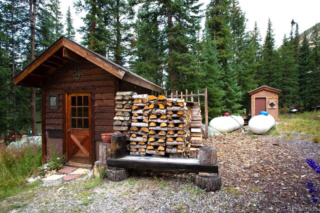 10 Bullion Mine Rd, Keystone, CO 80435 - view of outbuilding with a view of trees