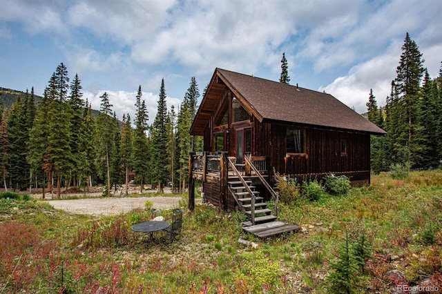10 Bullion Mine Rd, Keystone, CO 80435 - view of outdoor structure featuring stairway and a forest view