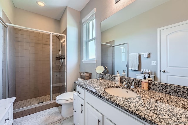 5923 S Jamestown Ct, Aurora, CO 80016 - full bathroom featuring vanity, a shower stall, and tile patterned flooring