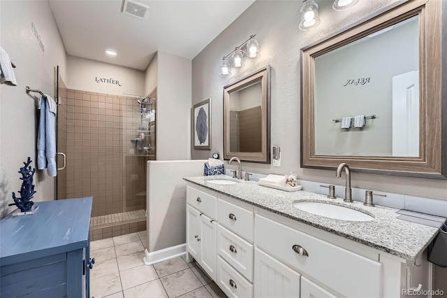 5923 S Jamestown Ct, Aurora, CO 80016 - full bath featuring double vanity, a shower stall, and tile patterned flooring