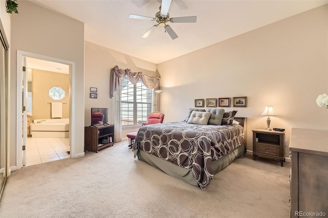 2700 W Riverwalk Cir Unit C, Littleton, CO 80123 - bedroom featuring light carpet, baseboards, ensuite bathroom, and a ceiling fan