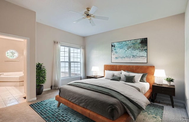 2700 W Riverwalk Cir Unit C, Littleton, CO 80123 - bedroom featuring light colored carpet, connected bathroom, and ceiling fan