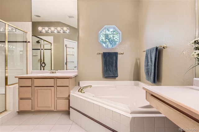 2700 W Riverwalk Cir Unit C, Littleton, CO 80123 - bathroom featuring a stall shower, a garden tub, vanity, and tile patterned floors