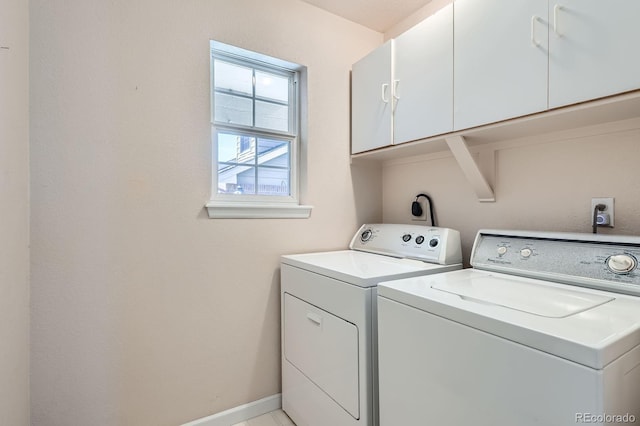 2700 W Riverwalk Cir Unit C, Littleton, CO 80123 - laundry room with cabinet space and washing machine and clothes dryer