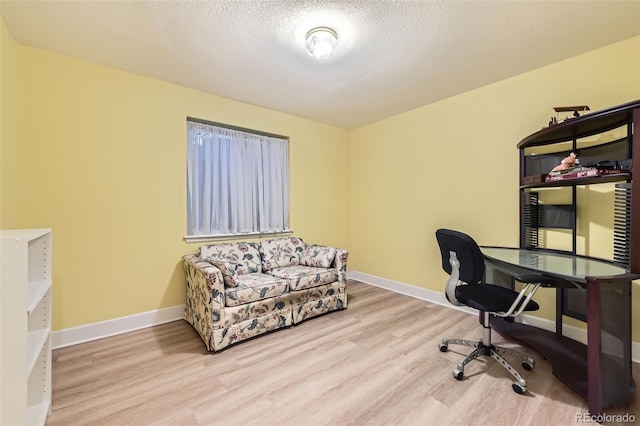 2700 W Riverwalk Cir Unit C, Littleton, CO 80123 - office space featuring wood finished floors and a textured ceiling