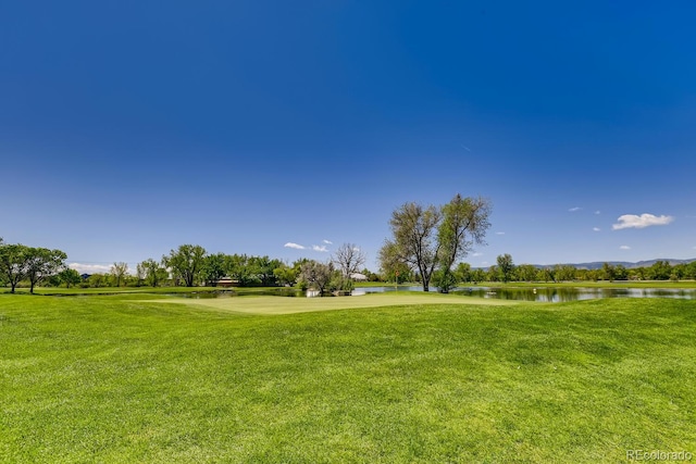 2700 W Riverwalk Cir Unit C, Littleton, CO 80123 - surrounding community with a water view and a yard