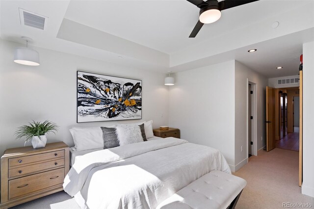 bedroom with ceiling fan and light colored carpet