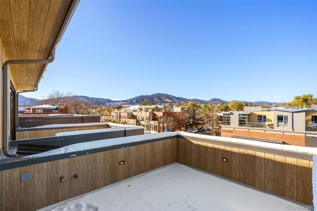 view of patio / terrace with a balcony and a mountain view