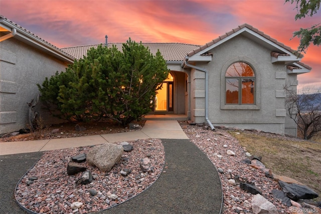 265 Ox Yoke Way, Monument, CO 80132 - view of front of home featuring a tile roof and stucco siding