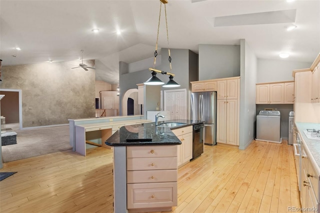 265 Ox Yoke Way, Monument, CO 80132 - kitchen with freestanding refrigerator, washing machine and dryer, dishwasher, a ceiling fan, and a sink