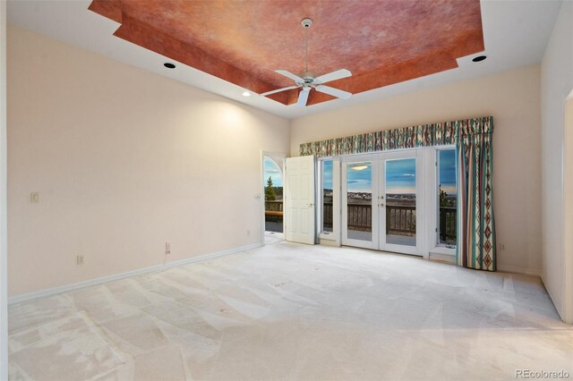 265 Ox Yoke Way, Monument, CO 80132 - unfurnished room with a raised ceiling, ceiling fan, light colored carpet, a skylight, and recessed lighting