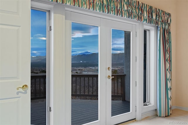 265 Ox Yoke Way, Monument, CO 80132 - doorway to outside with french doors, a mountain view, and baseboards