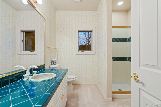 265 Ox Yoke Way, Monument, CO 80132 - full bath with wallpapered walls, vanity, a shower stall, and toilet
