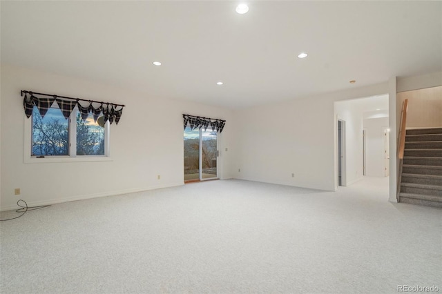 265 Ox Yoke Way, Monument, CO 80132 - empty room featuring stairway, light colored carpet, recessed lighting, and baseboards