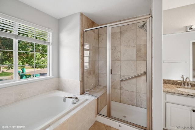 bathroom with vanity, separate shower and tub, and tile patterned floors