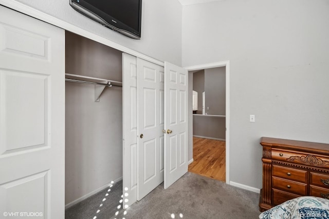 unfurnished bedroom featuring a closet and carpet floors