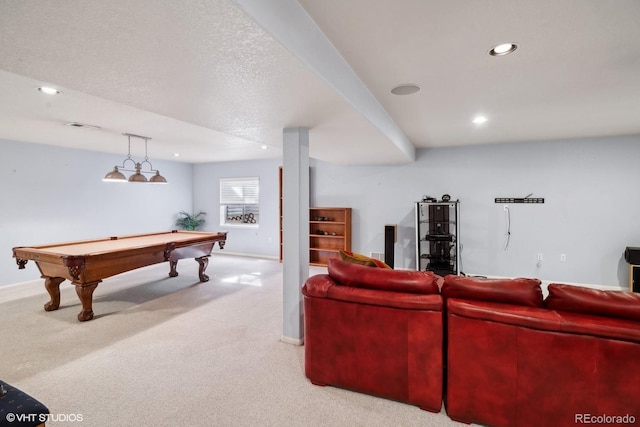 carpeted living room with a textured ceiling and billiards