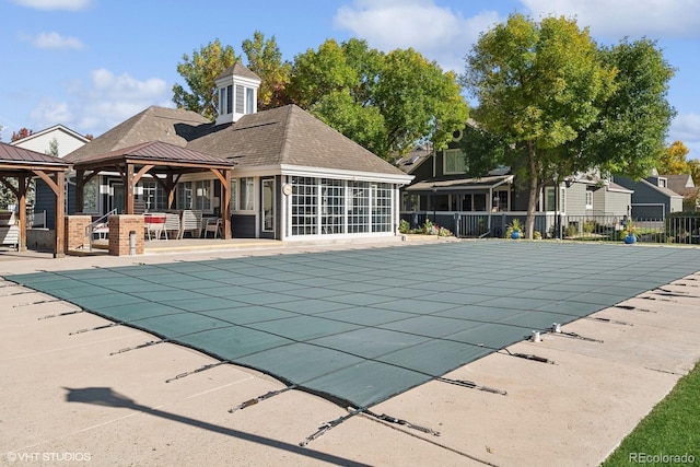 view of swimming pool featuring a gazebo and a patio