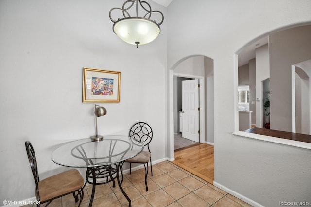 dining space with light hardwood / wood-style flooring