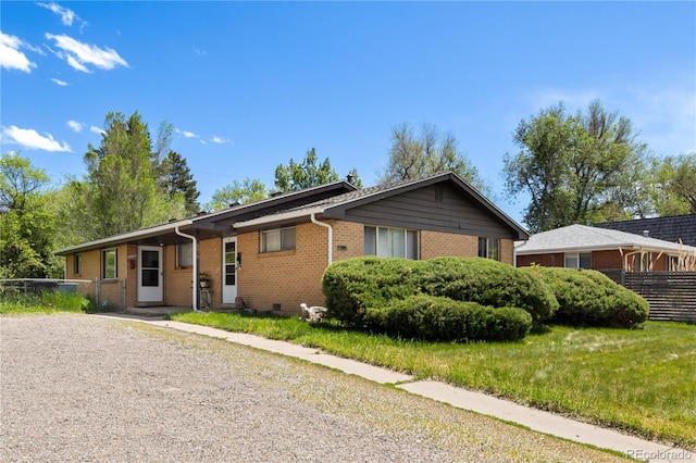 6018 S Prince St, Littleton, CO 80120 - single story home featuring brick siding