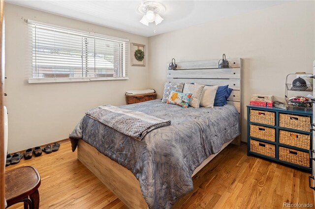 6018 S Prince St, Littleton, CO 80120 - bedroom featuring wood finished floors