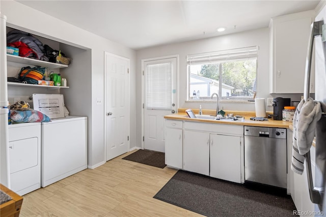 6018 S Prince St, Littleton, CO 80120 - kitchen with dishwasher, a sink, separate washer and dryer, white cabinets, and recessed lighting