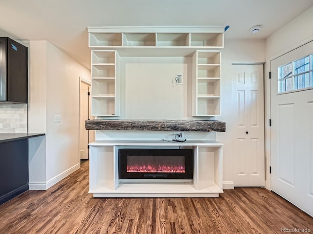 interior space featuring hardwood / wood-style flooring and backsplash