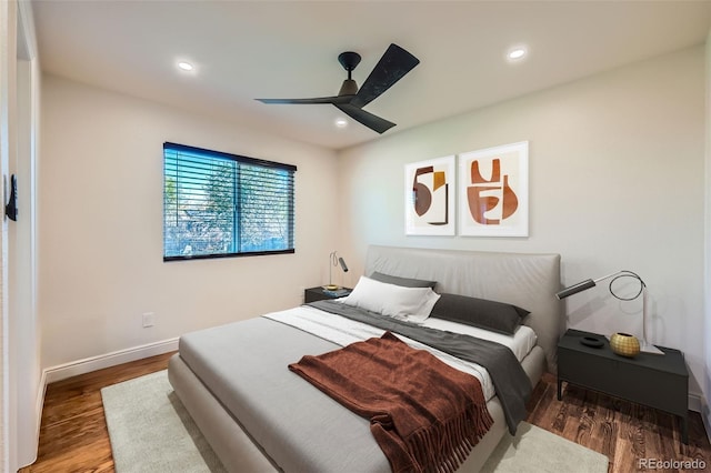 bedroom featuring wood-type flooring and ceiling fan