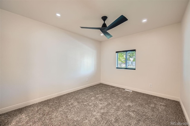 carpeted empty room featuring ceiling fan