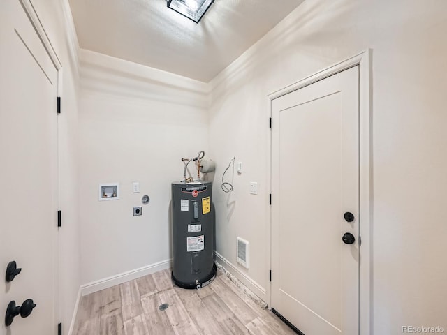 laundry area featuring light wood-type flooring, hookup for a washing machine, electric water heater, and electric dryer hookup