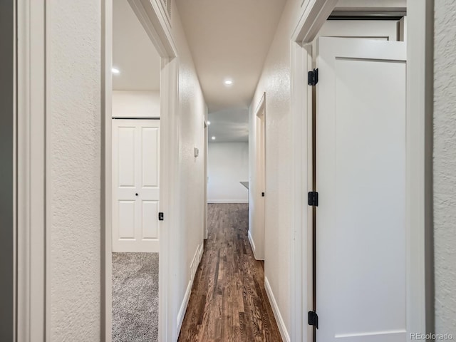 hallway with wood-type flooring