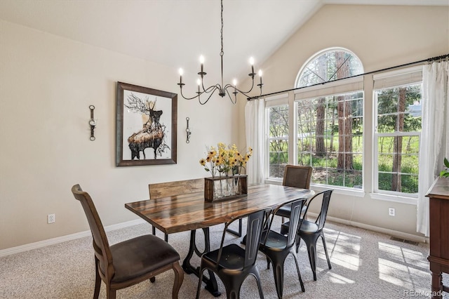 4185 Cheyenne Dr, Larkspur, CO 80118 - dining area featuring light colored carpet, a chandelier, lofted ceiling, and baseboards