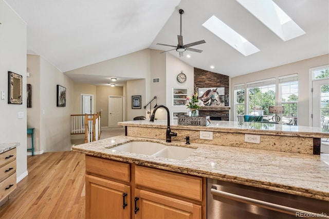 4185 Cheyenne Dr, Larkspur, CO 80118 - kitchen with a sink, dishwasher, light wood-type flooring, high vaulted ceiling, and open floor plan