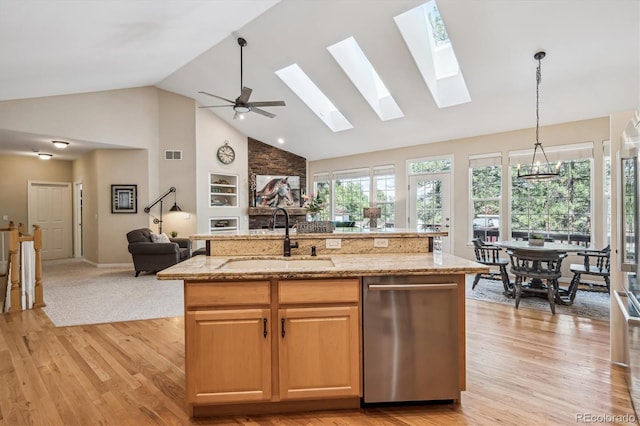 4185 Cheyenne Dr, Larkspur, CO 80118 - kitchen with a sink, open floor plan, high vaulted ceiling, light wood-type flooring, and light stone counters