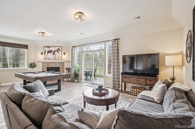 4185 Cheyenne Dr, Larkspur, CO 80118 - living room featuring baseboards, plenty of natural light, a tiled fireplace, and pool table