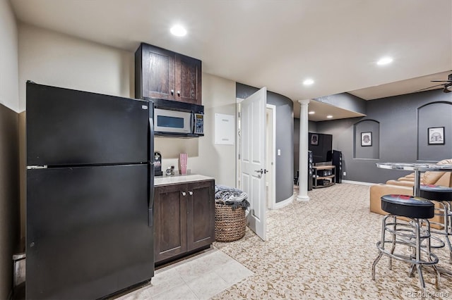 4185 Cheyenne Dr, Larkspur, CO 80118 - kitchen with freestanding refrigerator, dark brown cabinets, light carpet, recessed lighting, and baseboards