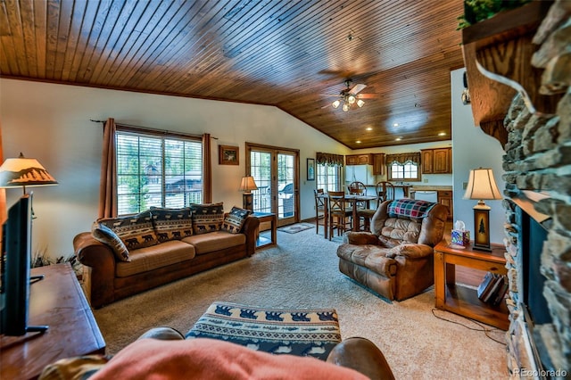 carpeted living room featuring a healthy amount of sunlight and wood ceiling