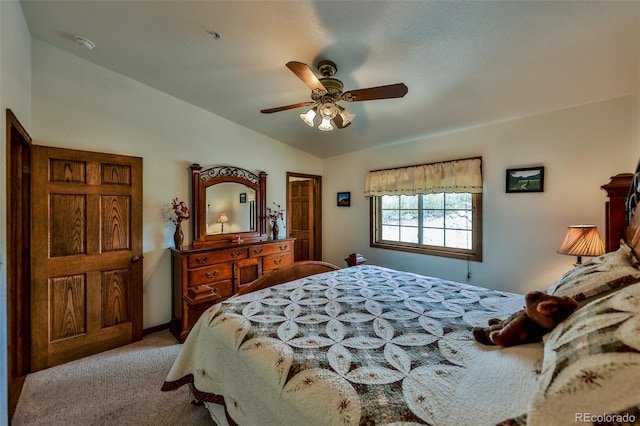 bedroom featuring carpet, ceiling fan, and vaulted ceiling