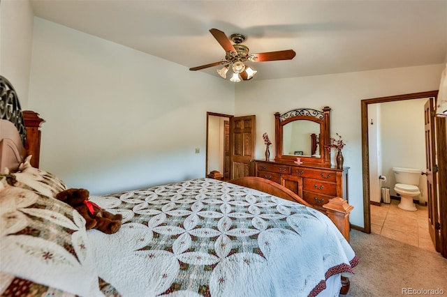 bedroom with carpet, ensuite bath, and ceiling fan